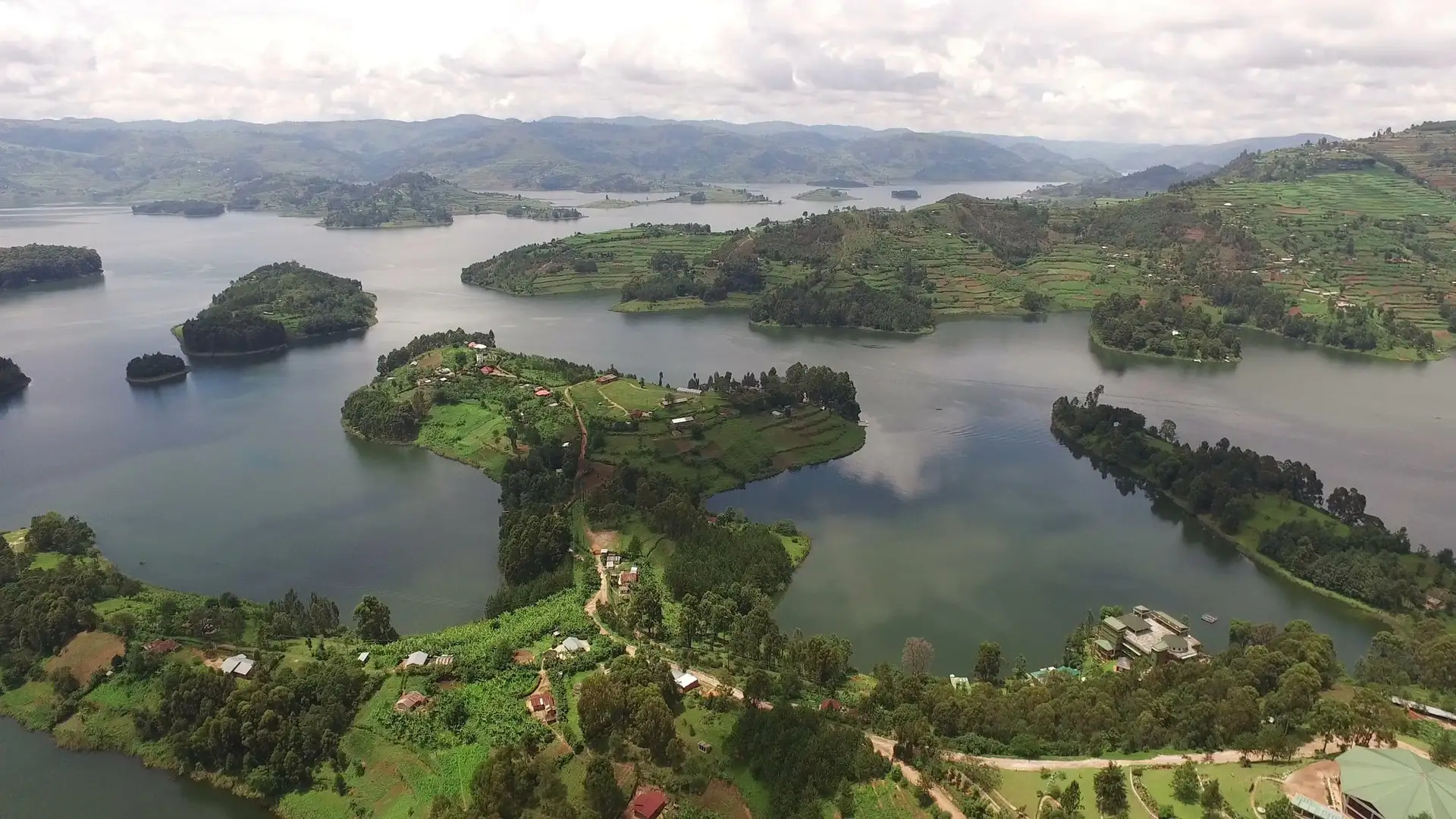 Aerial view of Lake Bunyonyi, its terraced hillsides and scattered green islands